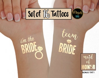 May include: Set of 16 gold temporary tattoos for a bridal party. The tattoos feature the phrases "I'm the Bride", "Team Bride", and "Maid of Honor".