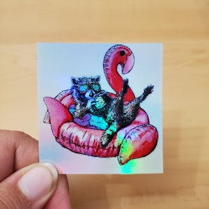 Sticker holographique festif raton laveur