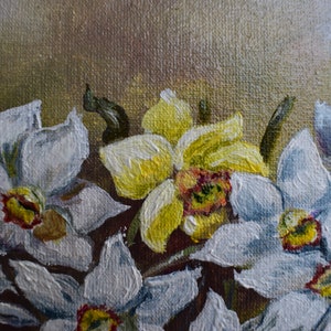 May include: A close-up of a painting of white and yellow daffodils. The flowers are painted with thick brushstrokes, giving them a textured appearance. The background is a muted brown.