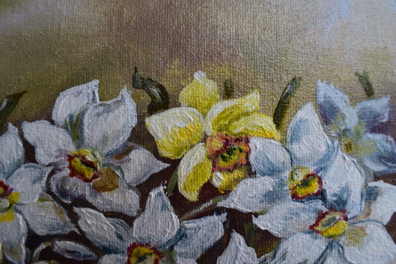 May include: A close-up of a painting of white and yellow daffodils. The flowers are painted with thick brushstrokes, giving them a textured appearance. The background is a muted brown.