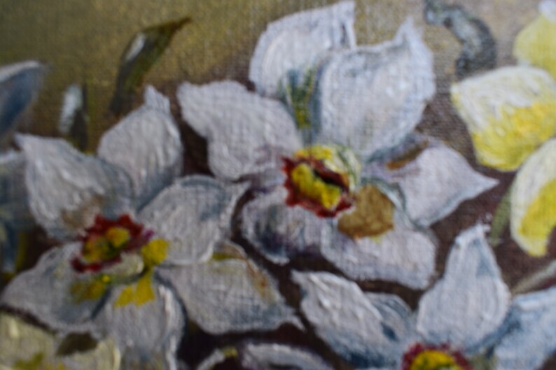 May include: A close-up of a painting of white flowers with yellow and red centers. The flowers are painted in a realistic style and have a soft, delicate appearance.