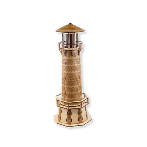 May include: A wooden model of a lighthouse with a brown roof and a detailed design. The lighthouse has a small window and a railing around the top.