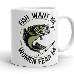 May include: White ceramic coffee mug with a black and green graphic of a fish with the text "Fish Want Me Women Fear Me" around it.