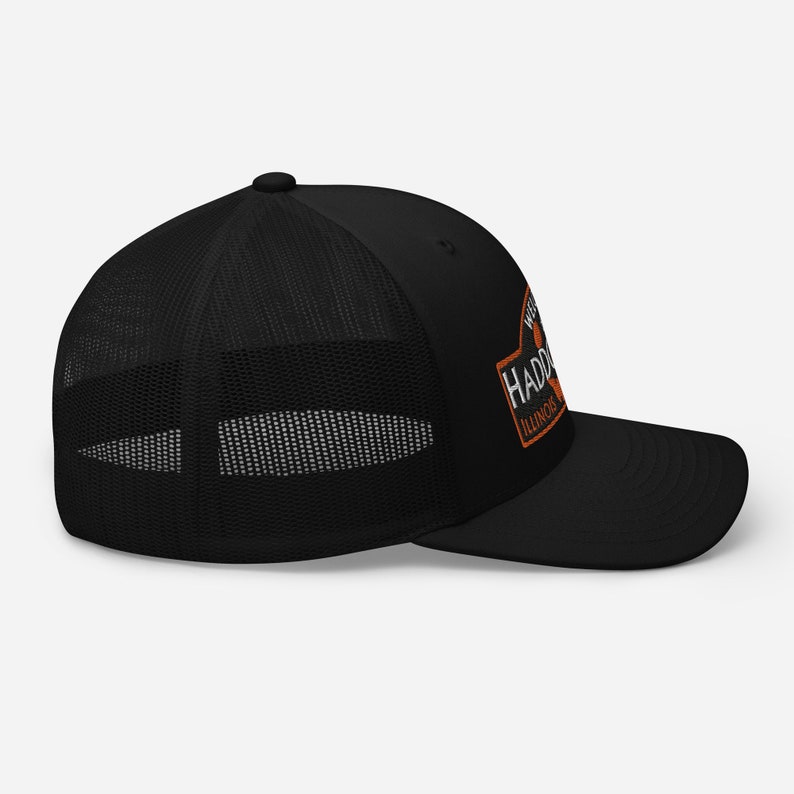 May include: Black trucker hat with a white and orange patch that says "Westfield Haddorff Illinois".