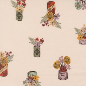 May include: A light beige fabric featuring a repeating pattern of illustrated coffee and tea tins filled with colorful floral arrangements. The tins are labeled with the words coffee or tea, and the flowers include sunflowers and various small blooms.
