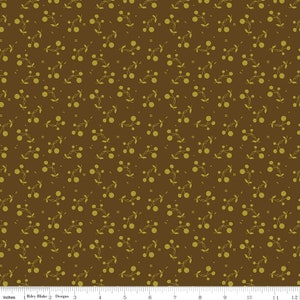 May include: A brown fabric with a repeating pattern of small green sprigs with three circles on each sprig.