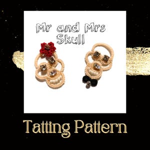 May include: Mr and Mrs Skull Tatting Pattern. Two white skull-shaped tatted lace ornaments with black and white bow tie and red flower embellishments.