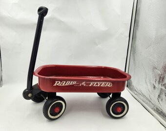 Vintage Very Small Radio Flyer Red Wagon with black handle - functioning wheels - some rust - wagon bed is 12.5" x 7.5"