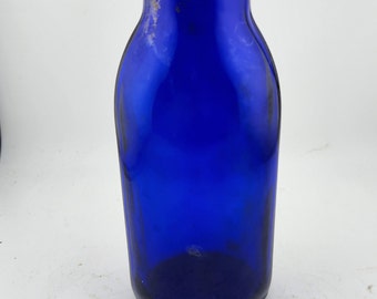 Vintage Glass Bottle Royal Blue with M and 2 marked on the bottom.  Some discoloration  Height 7" - No cap