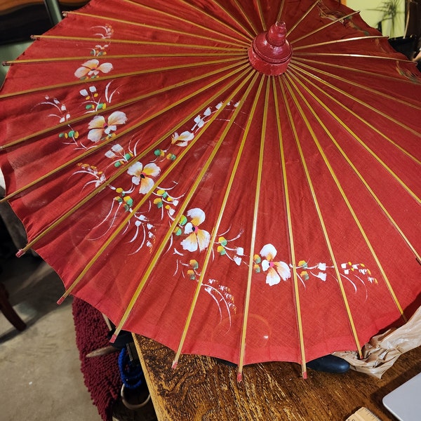 Vintage 27" Japanese Parasol 27" when opened.  Fabric and bamboo with 2 tiny pin holes.  Painted flowers, very beautiful