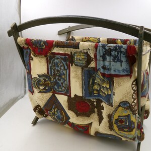 This is a Vintage Sewing Bag - Folds Flat and Opens with Chain on the Side  Height 13.5"  Width 11"  Length 13"