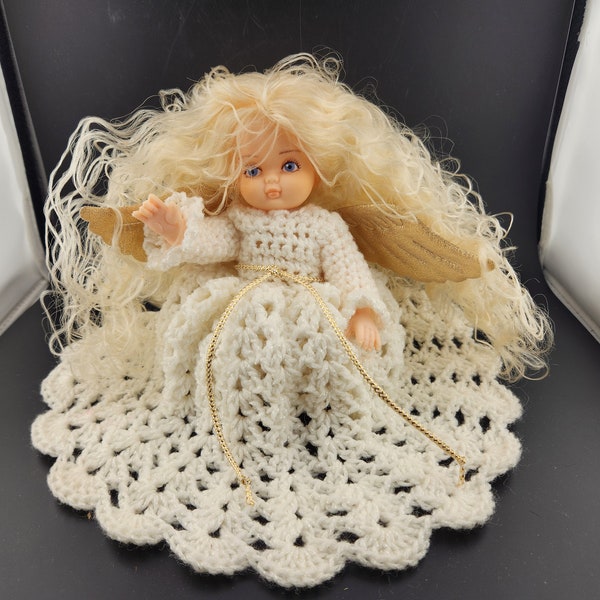 Vintage Plastic Doll with beautiful hand made crochet dress.  White yarn, beautiful wild blonde hair.  9.5"