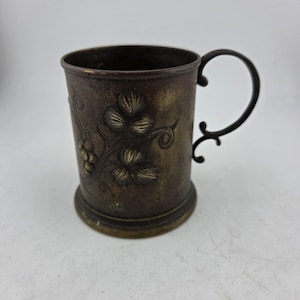 May include: A set of three ceramic mugs with a speckled, matte finish. The mugs are in shades of cream, light gray, and dark gray. Each mug has a simple, minimalist design, perfect for coffee or tea.