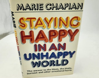 Vintage Book Staying Happy In An Unhappy World by Marie Chaplan    1985