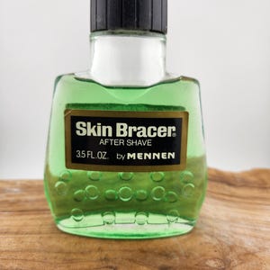 Vintage Collectible Skin Bracer After Shave by Mennen Bottle - Liquid still inside