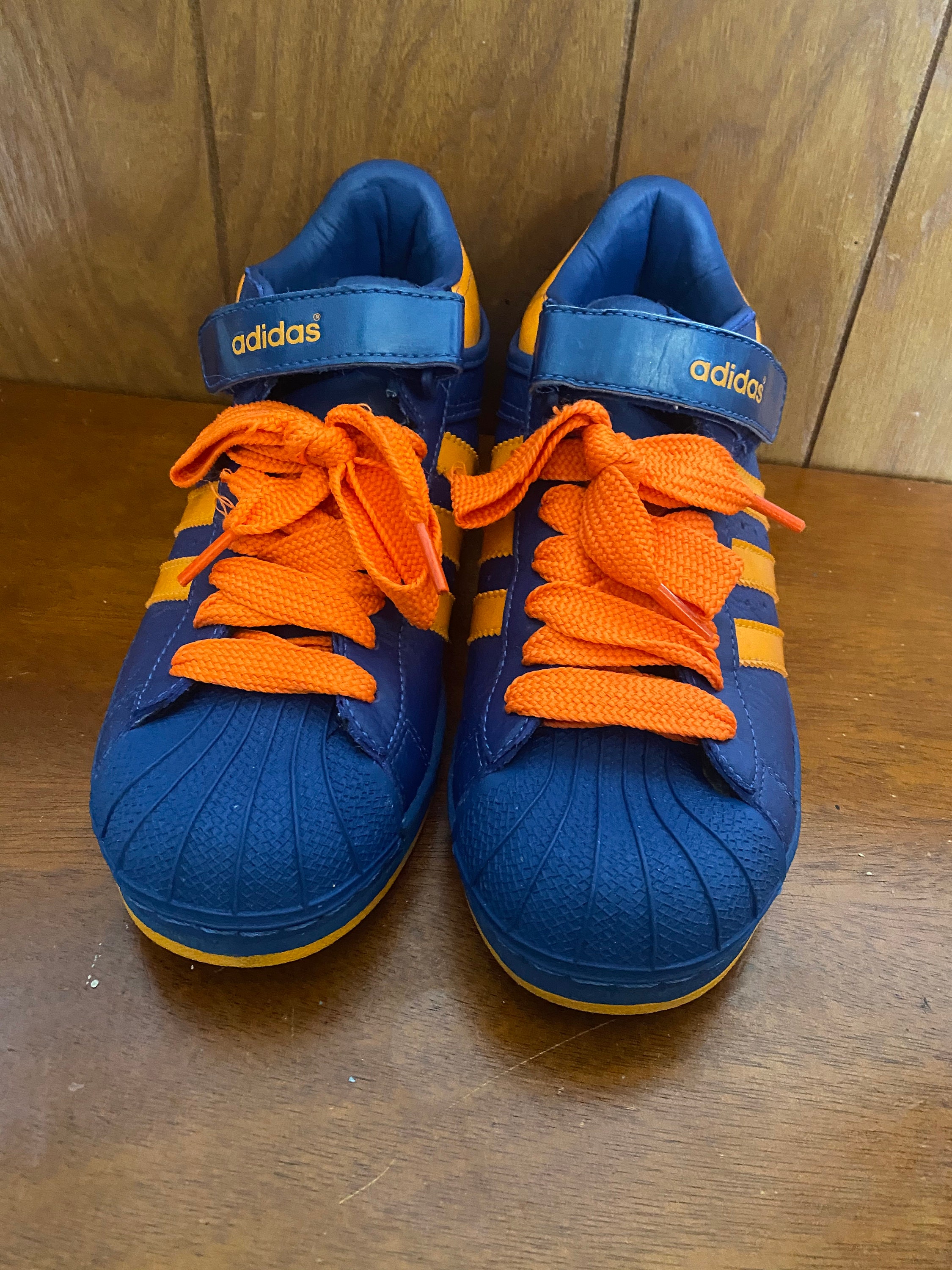 Orange and white adidas superstar cheap