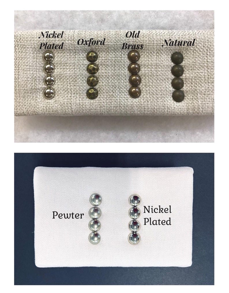 May include: Two fabric swatches with rows of metal tacks in different finishes. The top swatch has four rows of tacks labeled 'Nickel Plated', 'Oxford', 'Old Brass', and 'Natural'. The bottom swatch has two rows of tacks labeled 'Pewter' and 'Nickel Plated'.