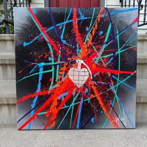 May include: Abstract painting on canvas with a black background and a white heart shape in the center. The heart is surrounded by colorful lines and splatters of paint in shades of red, orange, blue, green, and purple.