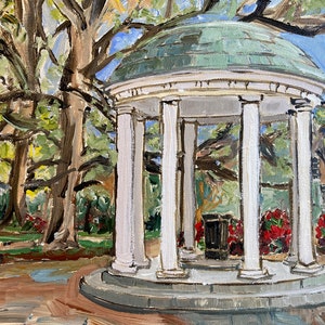 May include: A white, octagonal gazebo with a green roof, surrounded by lush green trees and red flowers. The gazebo has six white columns and a white base.
