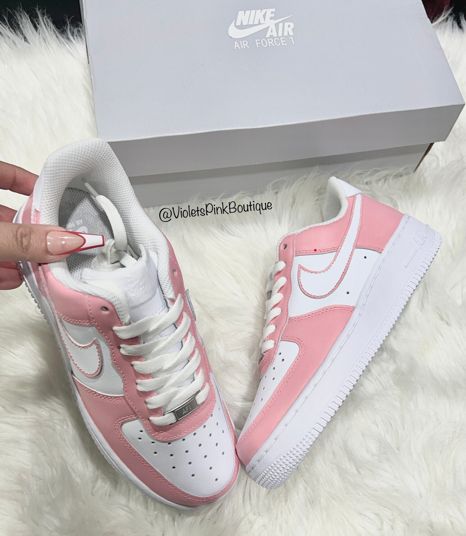women pink and white air force ones