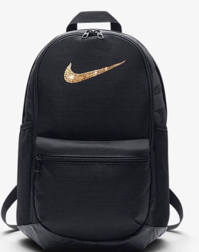 gold nike bag