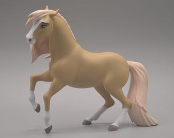 May include: A tan horse figurine with a white blaze on its face, a light-colored mane and tail, and white markings on its lower legs. The horse is depicted in a standing pose with one front leg raised, featuring brown hooves and dark eyes.