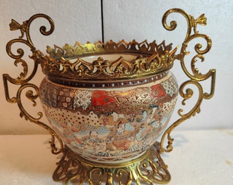 Satsuma jardinière with gilded bronze frame.