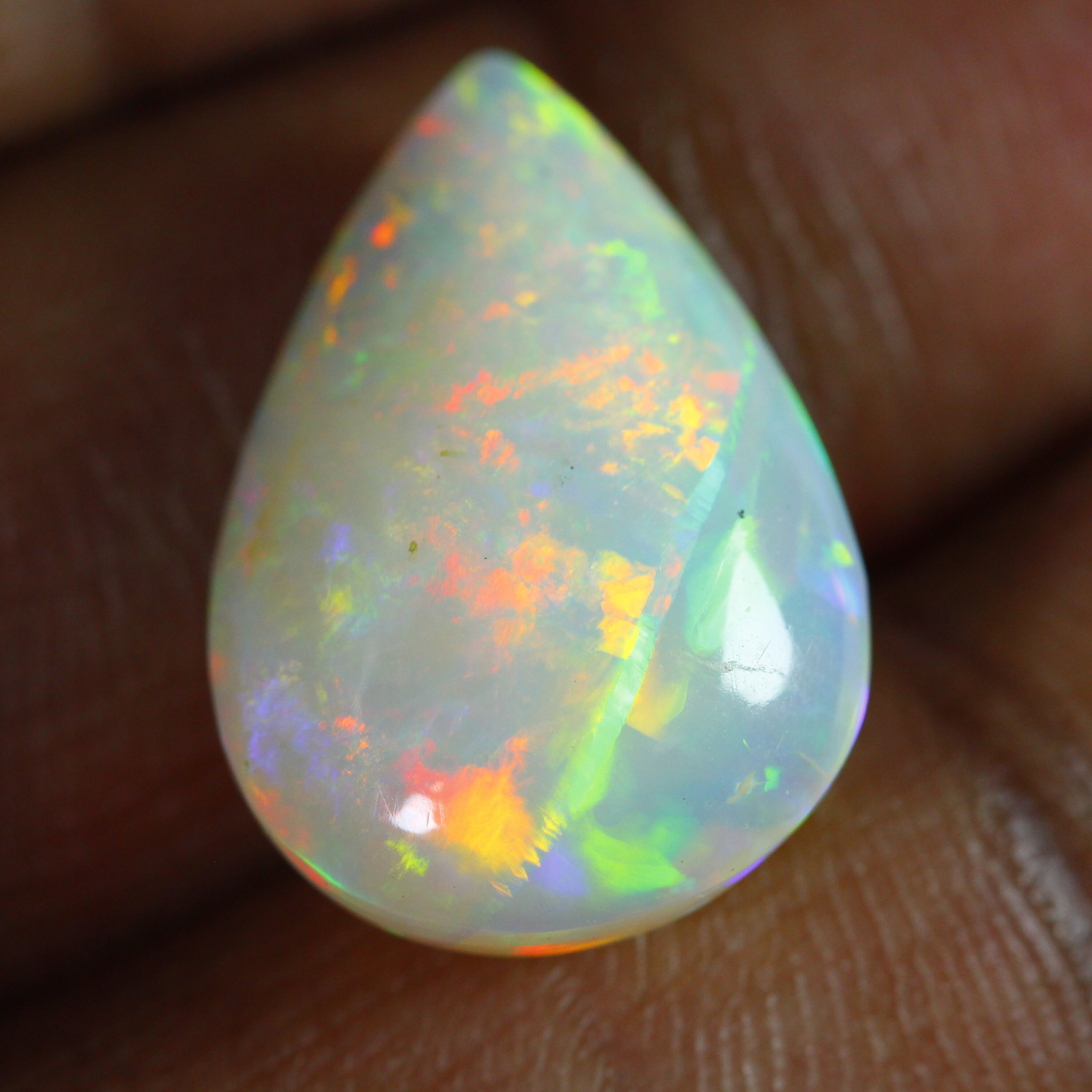 Fiery! OPAL Cabochon 9.07 Carats Pear. 20 X 13 mm Pear. Multi color Fire/Flashes. EARTH MIN
