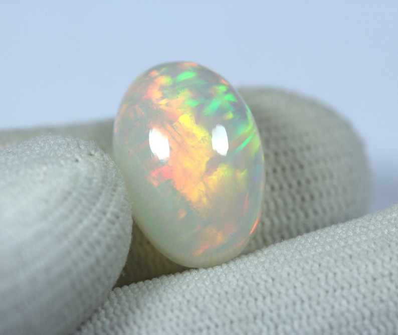 Magnificient OPAL Cabochon 11.03 Carats Oval Multi color FireFlashes 18 x 12.6 mm size Reasonable Price. EARTH MINED