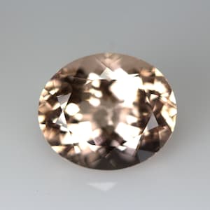 3.41 Carats Peach Color Morganite 10.65 x 9 MM Faceted Oval. Peach Pink Color. Clean Quality. Very Lustrous. Sparkling Facets.