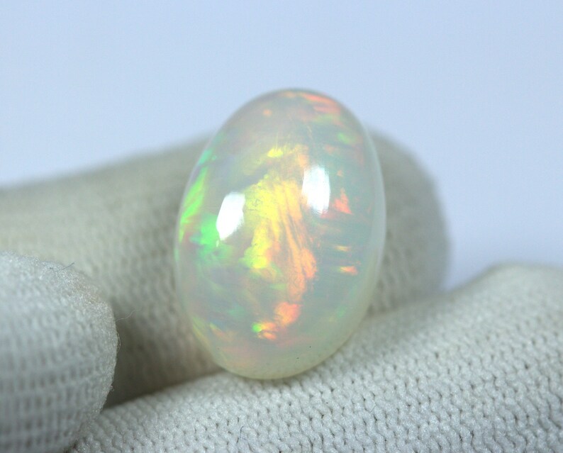 Magnificient OPAL Cabochon 11.03 Carats Oval Multi color FireFlashes 18 x 12.6 mm size Reasonable Price. EARTH MINED