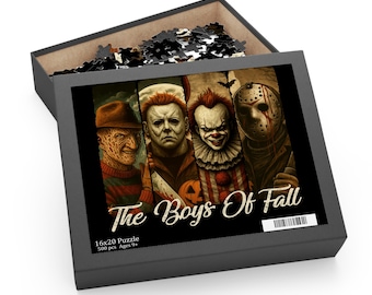May include: A black puzzle box with the title "The Boys Of Fall" featuring images of horror movie characters. The puzzle is 16x20 inches and contains 500 pieces. The box is open, revealing some of the puzzle pieces.