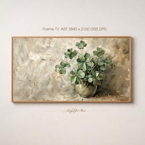 May include: A framed artwork depicting a still life of green plants in a metallic pot against a textured, neutral-toned background. The frame is a light wood colour. The text "Frame TV ART 3840 x 2160 (300 DPI)" is at the top.