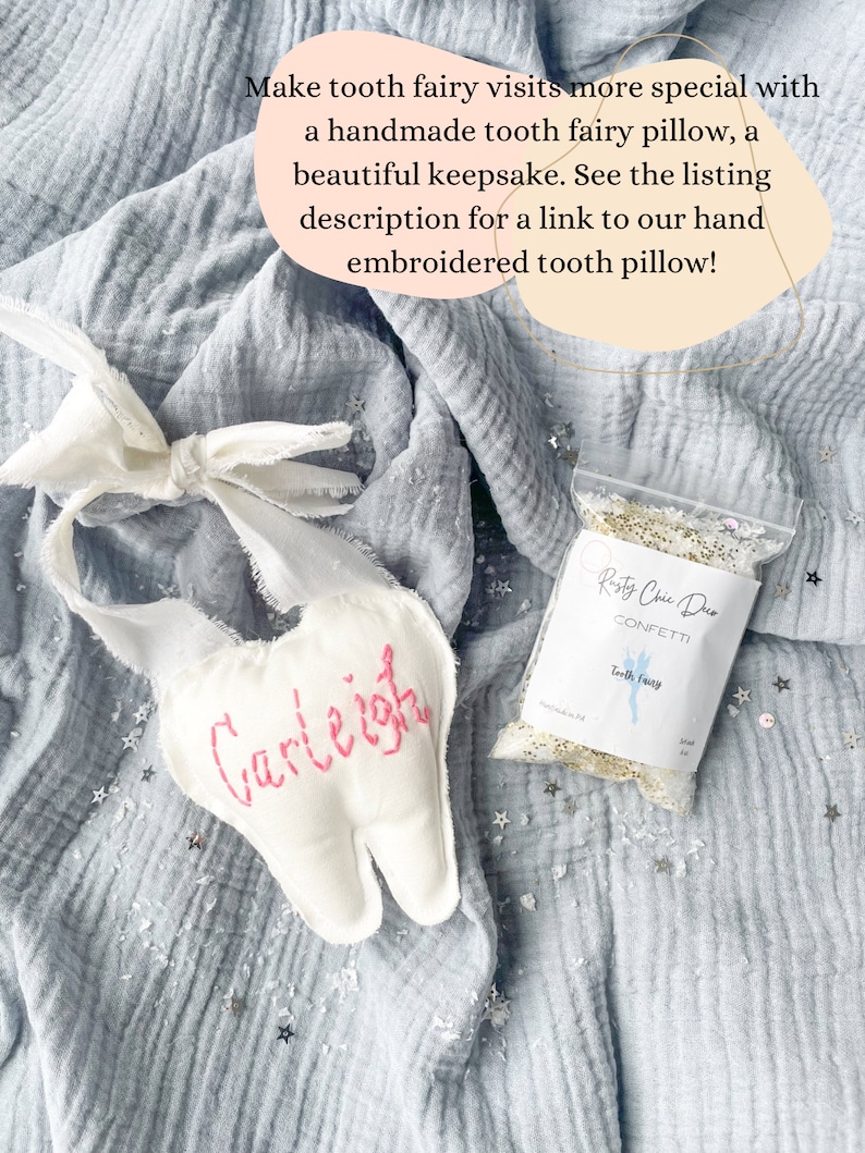 May include: A handmade white tooth fairy pillow with the name "Carleigh" embroidered in pink. A small bag of confetti and text that reads "Rasty Chic Duo Confetti Tooth Fairy" are also in the image.