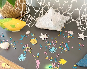 Confeti Bajo el Mar: Decoraciones para Fiesta de Cumpleaños de Sirenas en tonos pastel o brillantes.
