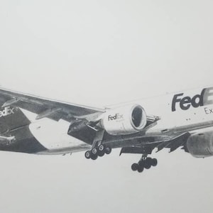 May include: A black and white pencil drawing of a FedEx Boeing 777-F cargo plane in flight. The plane is painted white with the FedEx logo and "FedEx Express" in large letters on the side.
