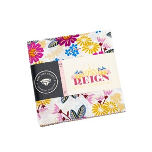 May include: A charm pack of 42 - 5 inch fabric squares featuring a floral print with pink, yellow, blue, and gold accents. The fabric is designed by Rashida Coleman Hale and is part of the "Reign" collection.