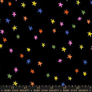 May include: Black fabric featuring a random pattern of colourful stars in yellow, pink, orange, blue, and green. The stars are hand-drawn in a whimsical style.