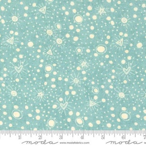 May include: A teal blue fabric with a white pattern of stars, hearts, circles, and triangles. The fabric is from the "Moda" brand.
