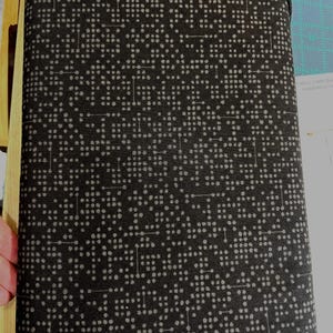 May include: Black fabric with a white pattern of small dots and lines. The pattern resembles a circuit board.