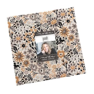 May include: A square fabric bundle featuring a floral pattern in shades of beige, brown, gray, and black. The fabric is adorned with large stylized flowers and foliage. A label with the text "moda posh" and a woman's image is attached.