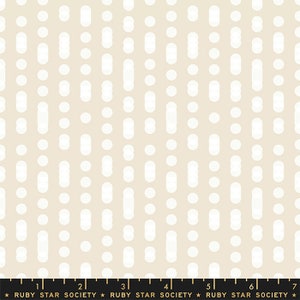 May include: A beige fabric with a white repeating pattern of circles and ovals. The pattern is evenly spaced and creates a subtle geometric design.