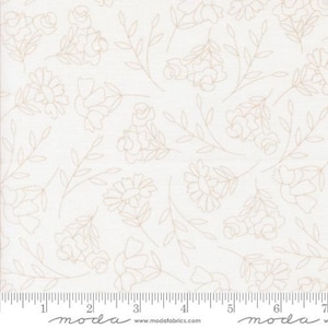 May include: Off-white fabric with a repeating pattern of sketched beige flowers and leaves. The floral design includes roses and daisy-like blooms. A ruler is visible along the bottom edge, marked in inches.
