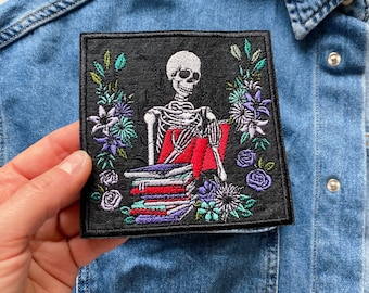 Reading Skeleton Iron On Patch: Bookworm Embroidered Applique