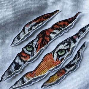 Tijgerklauw opstrijkpatch: jungledieren naaiappliqué