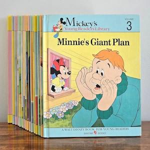 May include: A stack of 15 vintage Mickey Mouse Young Readers Library books, volume 3, titled "Minnie's Giant Plan". The cover features Minnie Mouse peeking out of a window and a surprised boy with his hands over his ears.