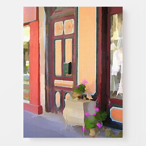 May include: A painting of a storefront with a red door and a window display. The door has a decorative design and a small mailbox. There are pink flowers in pots on the sidewalk in front of the store.
