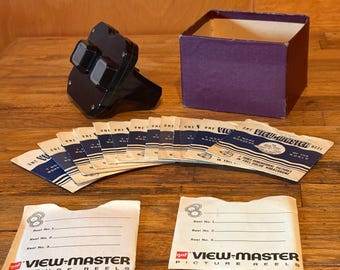 Visor estereoscópico View-Master Deluxe de Sawyer con colección de discos de estados y atracciones de Estados Unidos.