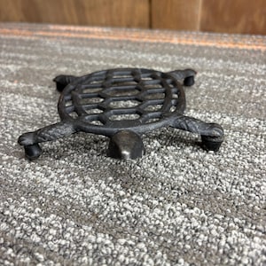 May include: A set of three ceramic mugs with a speckled, matte finish. The mugs are in shades of cream, light gray, and dark gray. Each mug has a simple, minimalist design, perfect for coffee or tea.