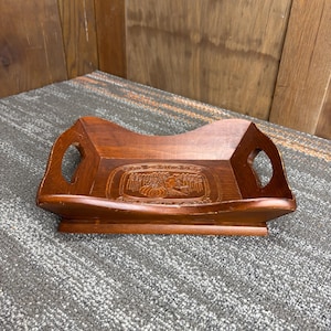 May include: A set of three ceramic mugs with a speckled, matte finish. The mugs are in shades of cream, light gray, and dark gray. Each mug has a simple, minimalist design and a rounded handle.